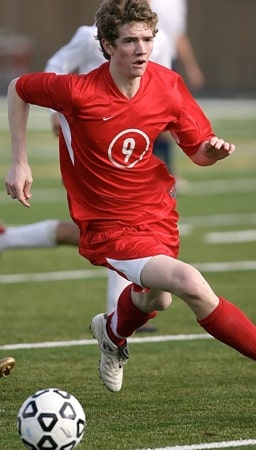 Soccer player running on the pitch